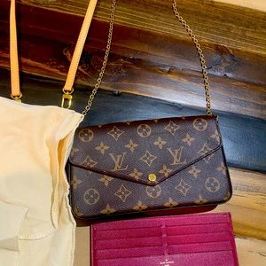 Original Louis Vuitton bag, includes card holder and an extra strap.